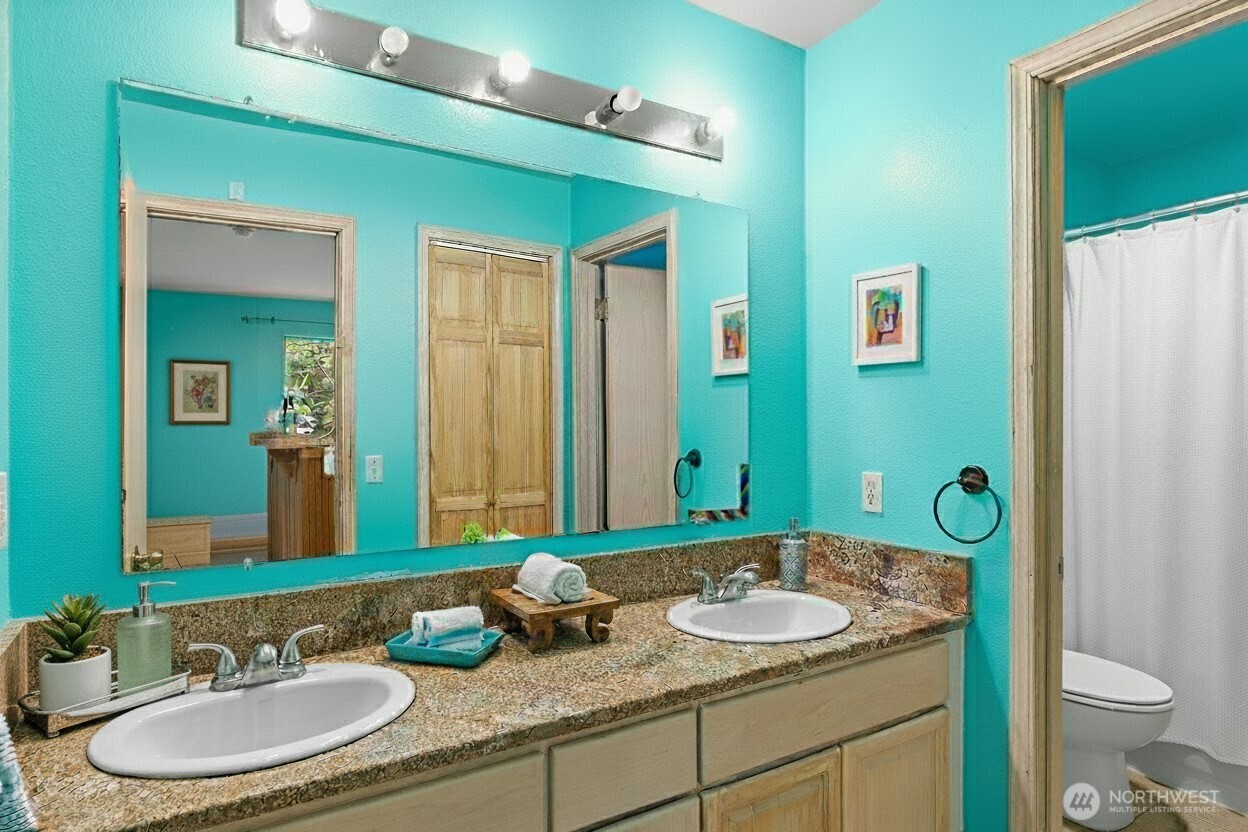 605 40th Place Everett, WA 98201 - Photo 31 of 39 a bathroom with a granite countertop sink and a mirror