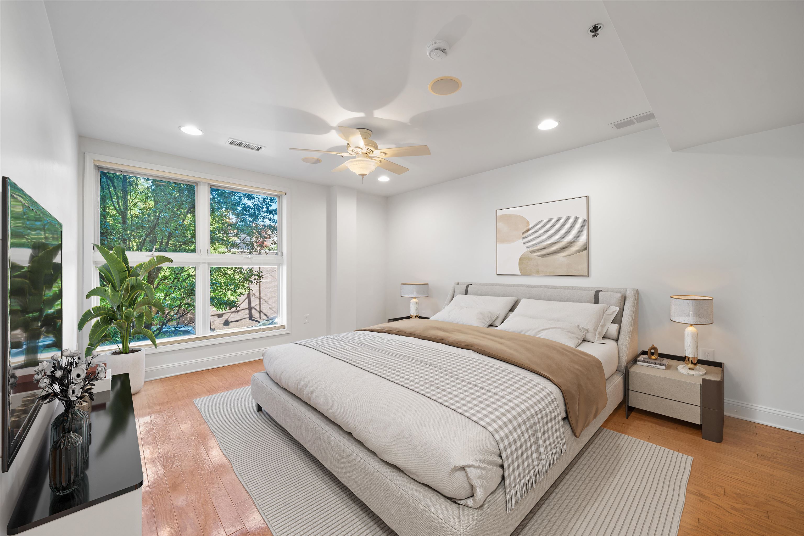 70 Adams Street, Unit 2F Hoboken, NJ 07030 - Photo 4 of 20 a spacious bedroom with a large bed and a large window