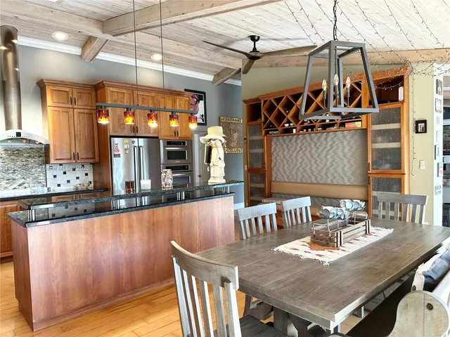 a view of a dining table and chairs in the kitchen