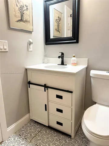 a utility room with refrigerator and washer