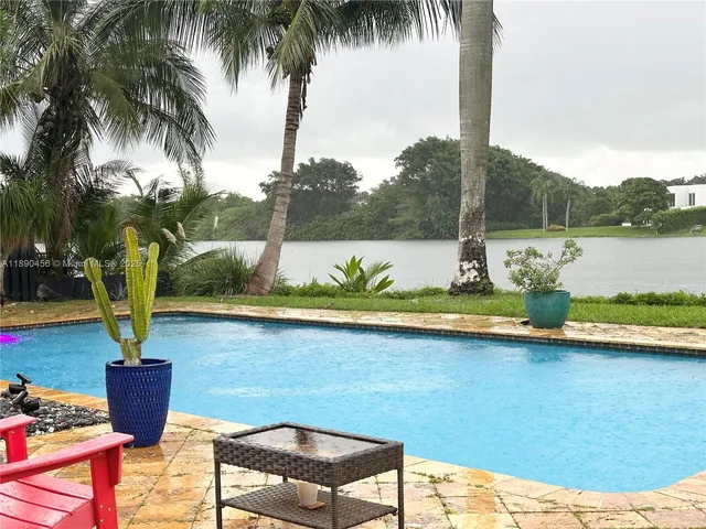 a view of a patio with a lake view