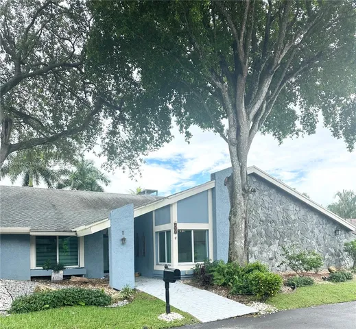 a view of swimming pool with a table and chairs