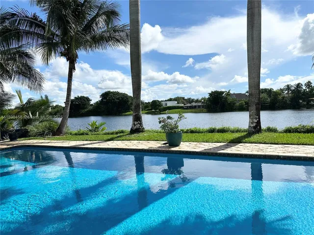 a view of swimming pool with a patio