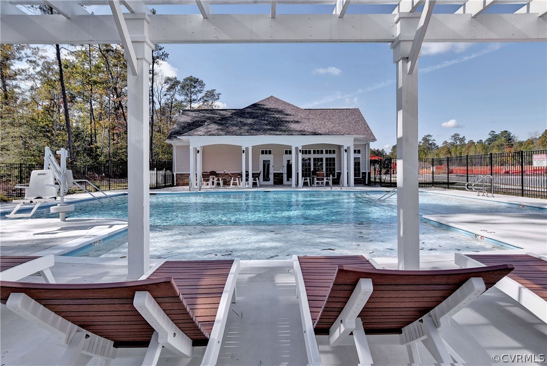 204 Arbordale Loop Williamsburg, VA 23188 - Photo 37 of 41 a view of a patio with table and chairs and wooden floor