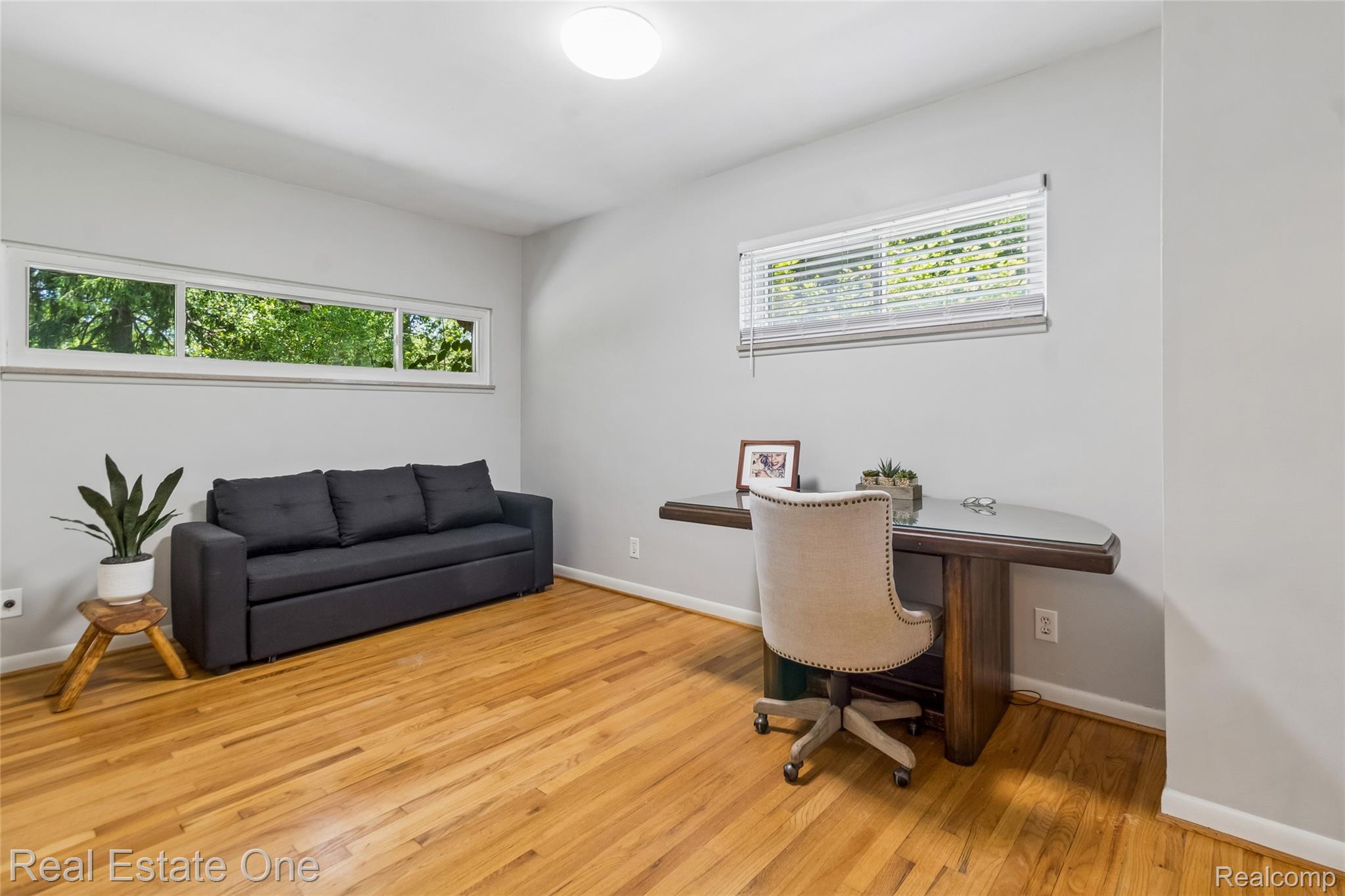 2189 Devonshire Road Bloomfield Hills, MI 48302 - Photo 22 of 50 Bright room featuring wood-finish flooring and light gray painted walls