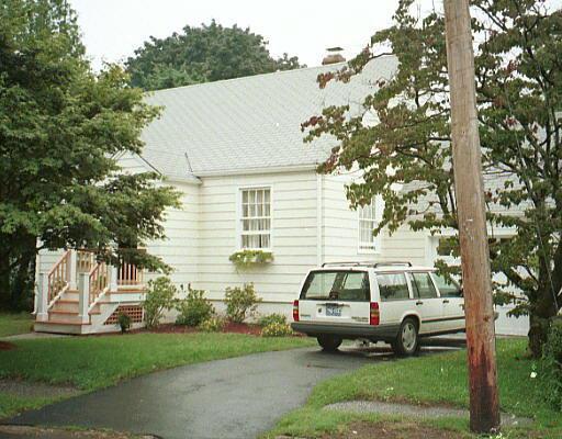 a car parked in front of a house