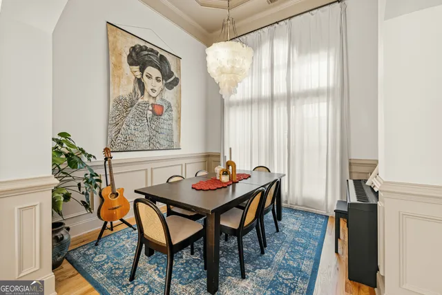 a view of a dining room with furniture window and wooden floor