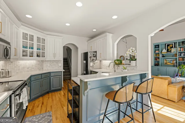 a kitchen with a sink cabinets and window