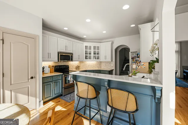 a bathroom with double vanity sink and a mirror