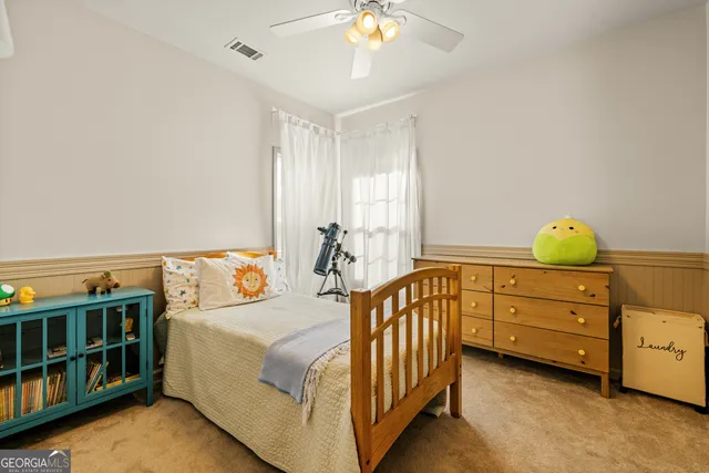 a bed room with furniture and a window