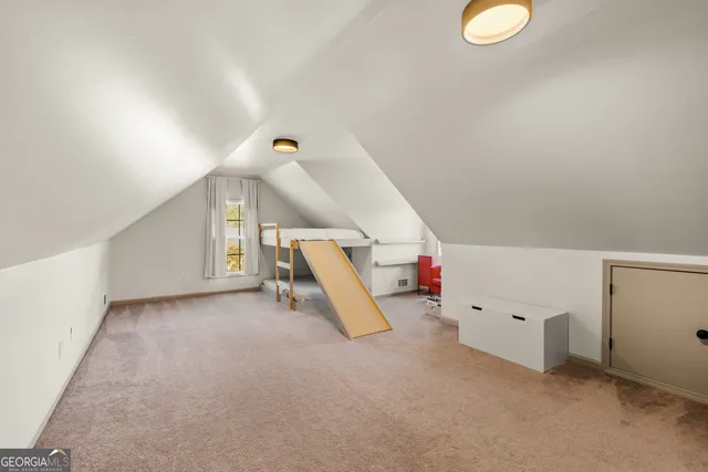 a bed room with a bed and a large window