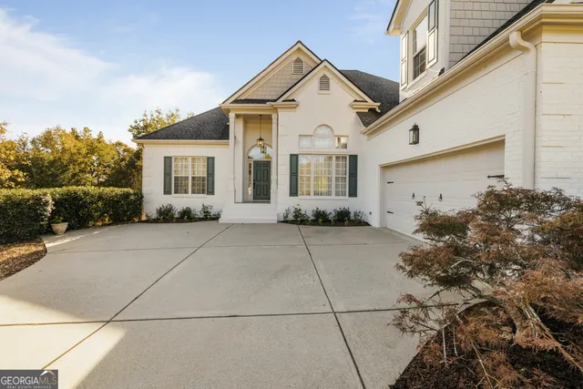a living room with furniture fireplace and a window