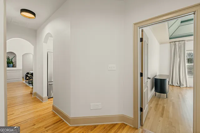 a bathroom with a sink a window and a shower
