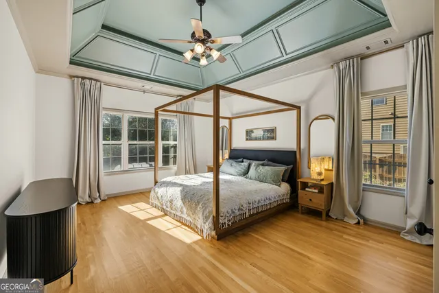 a view of walk in closet with clothes