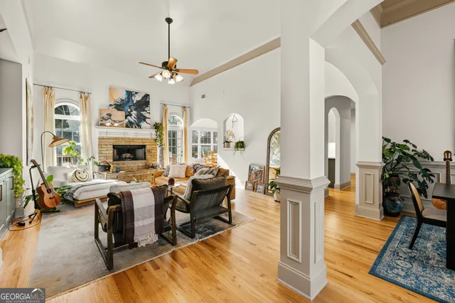 a view of a dining room with furniture and a chandelier