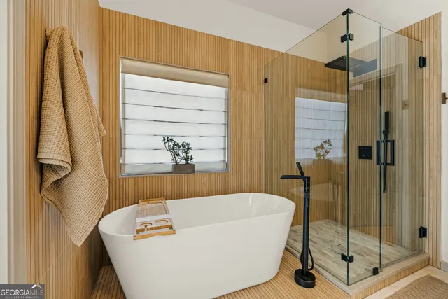 a spacious bedroom with a bed and a car