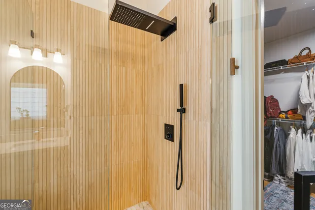 a living room with furniture a ceiling fan and a rug
