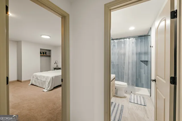 a view of a house with snow on the side of the road