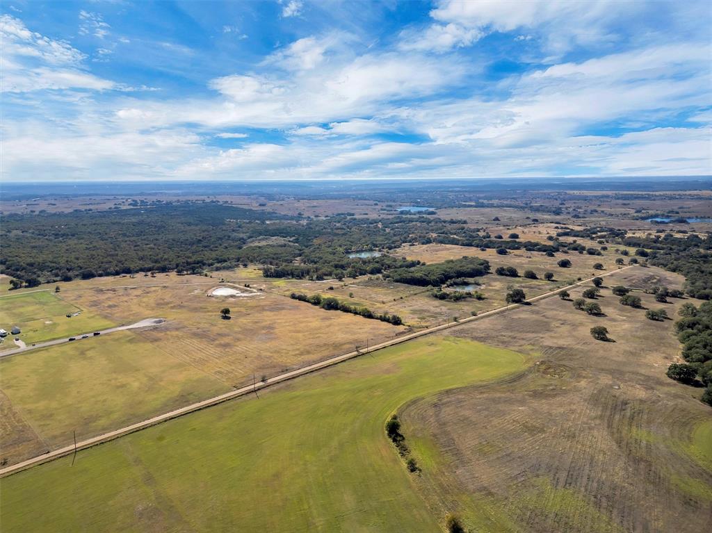 2414 Campbell Road Tolar, TX 76476 - Photo 30 of 31 a view of a swimming pool with an ocean view