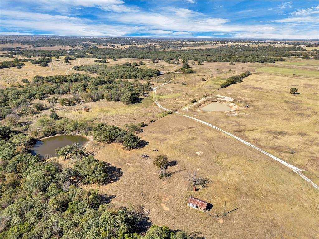 2414 Campbell Road Tolar, TX 76476 - Photo 8 of 31 an aerial view of residential houses with outdoor space