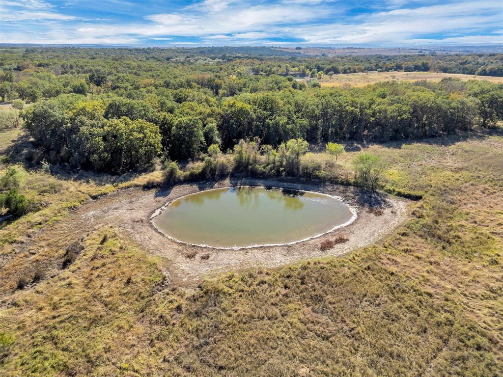 2414 Campbell Road Tolar, TX 76476 - Photo 9 of 31 a view of a swimming pool with a mountain