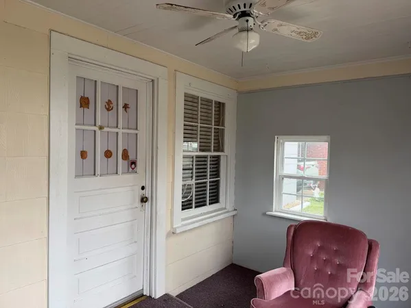 a view of livingroom with furniture and chandelier fan