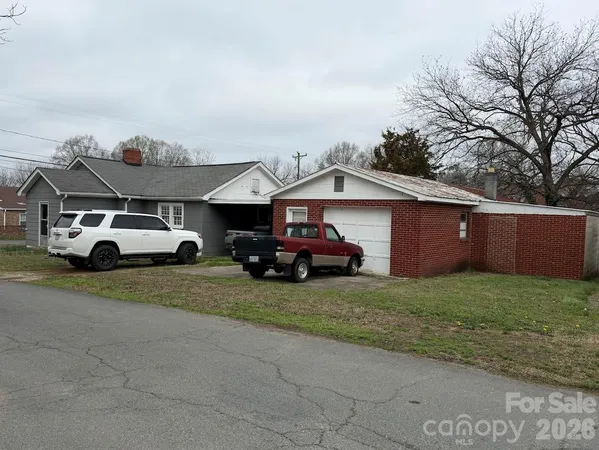 a view of a car parked in front of a house