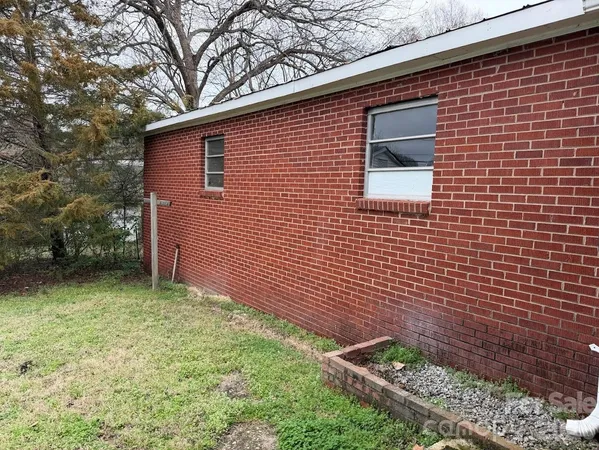 a view of backyard of a house