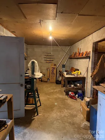 a view of a garage with cars parked