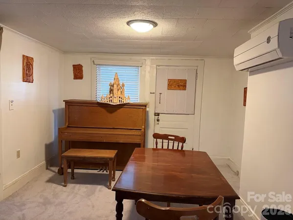 a living room with furniture and a table