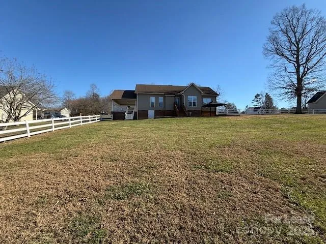 a view of a large garden with large trees