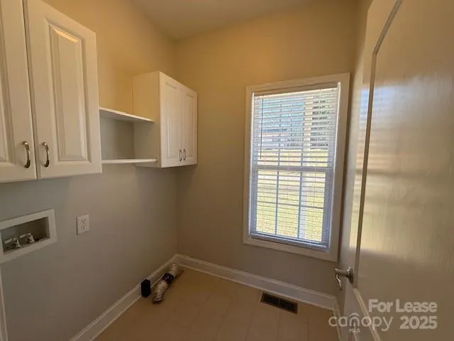 a bathroom with sink and window