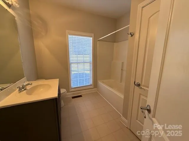 a bathroom with a sink and a shower