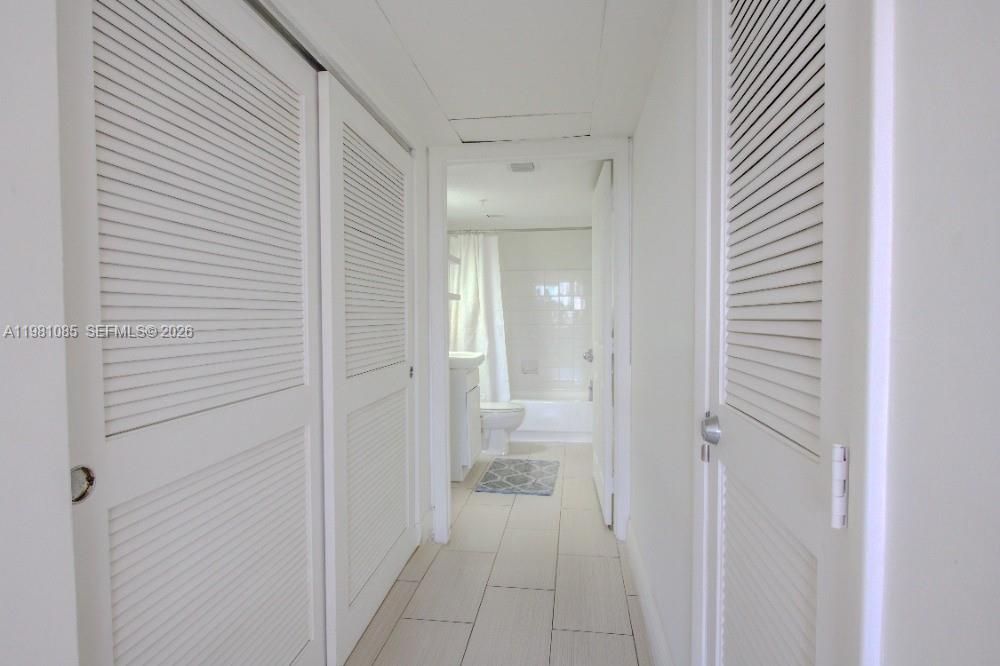 1500 Bay Road, Unit 528S Miami Beach, FL 33139 - Photo 10 of 11 a view of a bathroom from the hallway