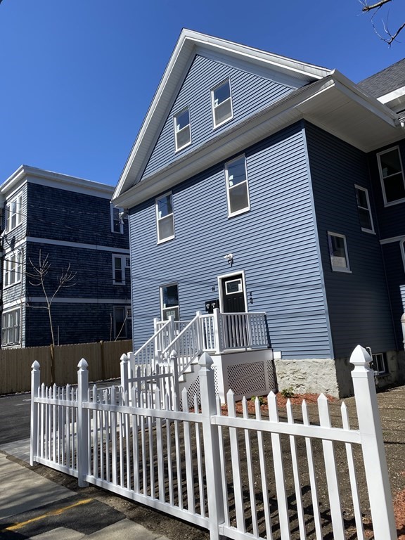 41 School Street, Unit 1 Boston, MA 02124 - Photo 23 of 25 a front view of a house with iron fence
