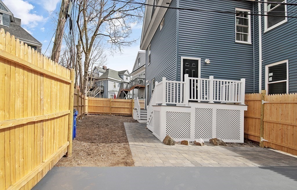 41 School Street, Unit 1 Boston, MA 02124 - Photo 9 of 25 a view of a house with a street
