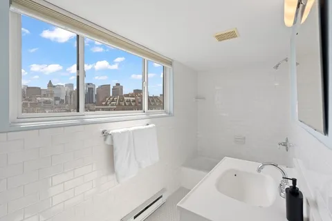 a bathroom with a bathtub and a sink