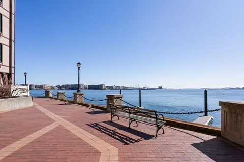 a bench sitting on top of a wooden floor