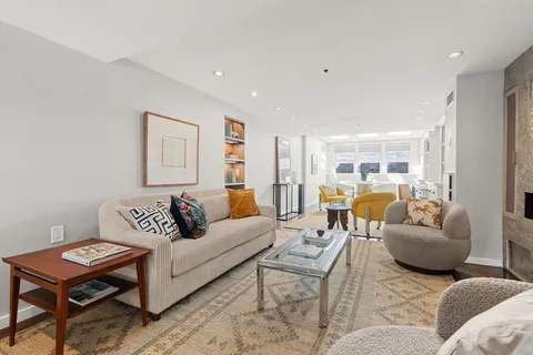 a living room with furniture and a table
