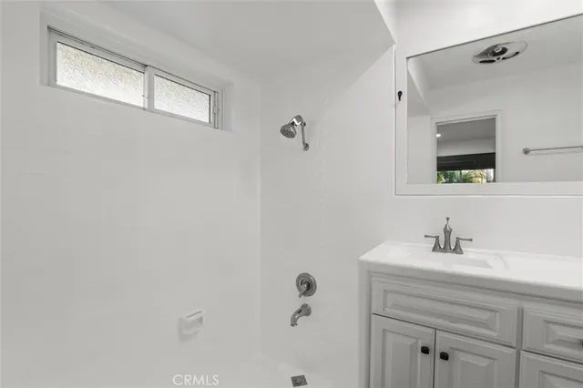 a bathroom with a bathtub and a sink