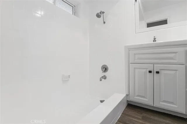 a bedroom with a bed chair and a window