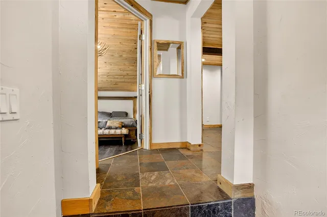 a view of a livingroom with furniture and a flat screen tv