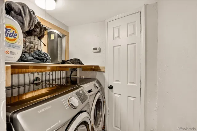 a balcony with wooden floor table and chairs