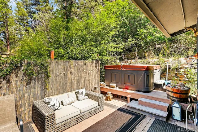 a view of patio with couple of couch and chairs