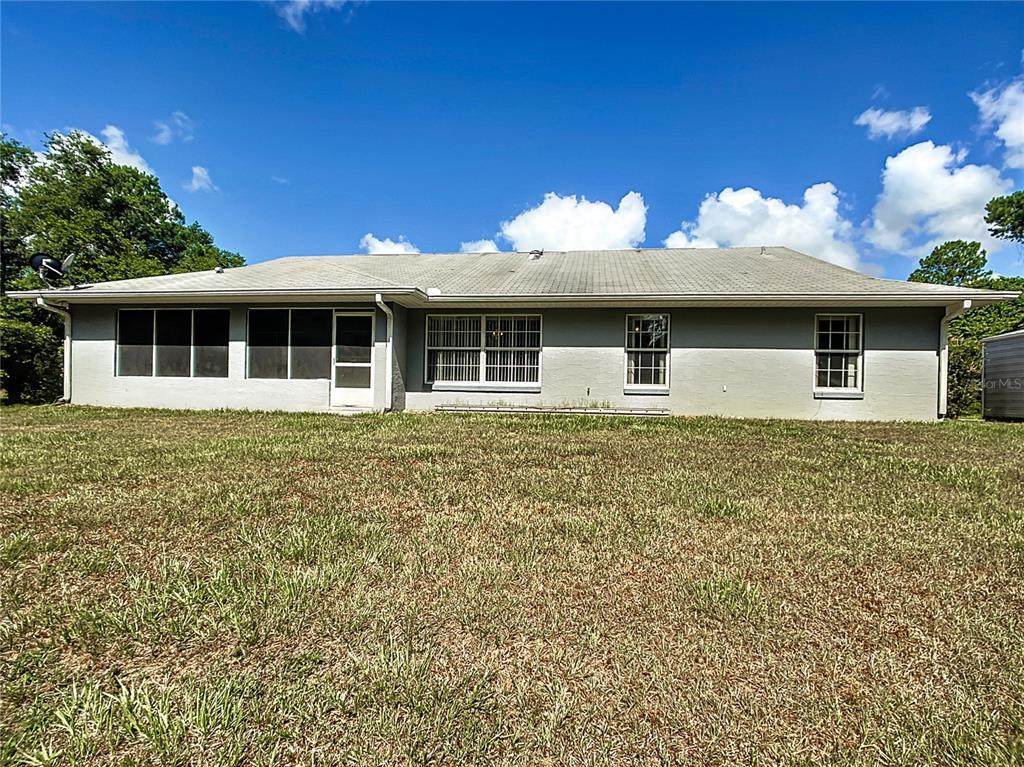 40 Hickory Loop Way Ocala, FL 34472 - Photo 18 of 31 Rear view of house