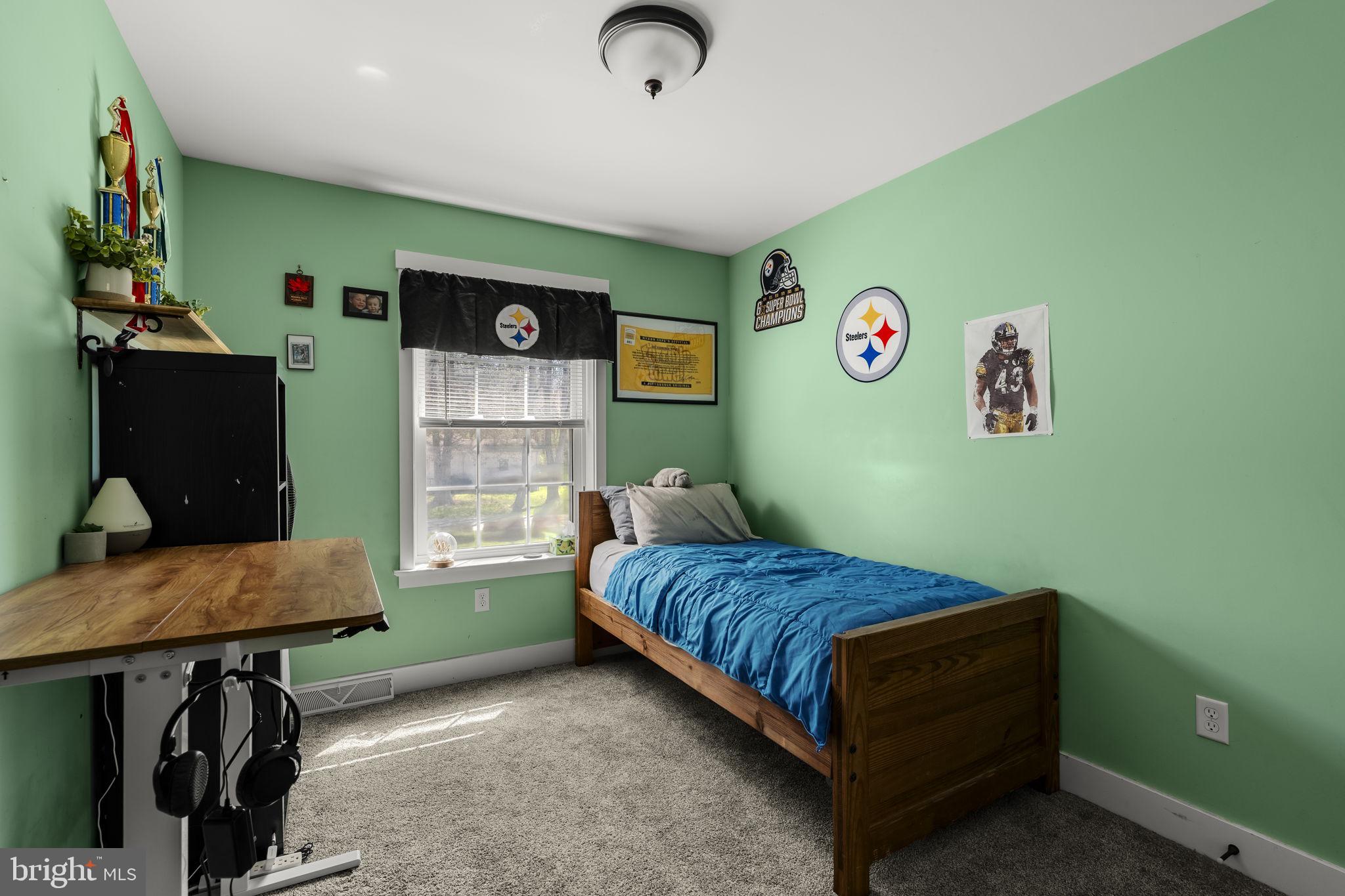 744 Lime Quarry Road Gap, PA 17527 - Photo 52 of 76 a bedroom with a bed and a desk