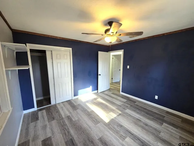 a view of an empty room with a chandelier