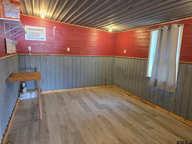 a patio with a table and chairs