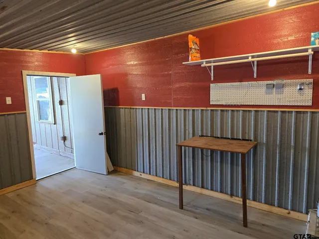 a view of outdoor space with wooden floor