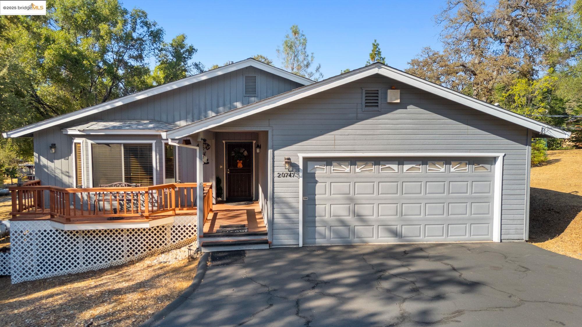 20747 Rising Hill Circle Groveland, CA 95321 - Photo 16 of 60 a view of a house with a yard and roof deck